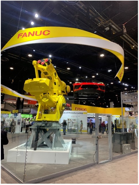 The largest industrial robot, made by Fanuc, shown lifting a car. This machine is used in place of cranes in production lines.